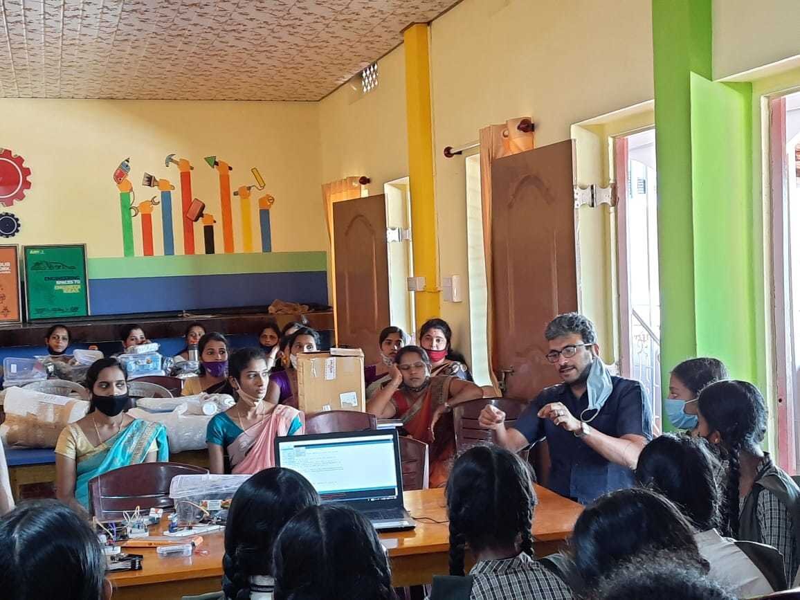 school classroom with students and teachers