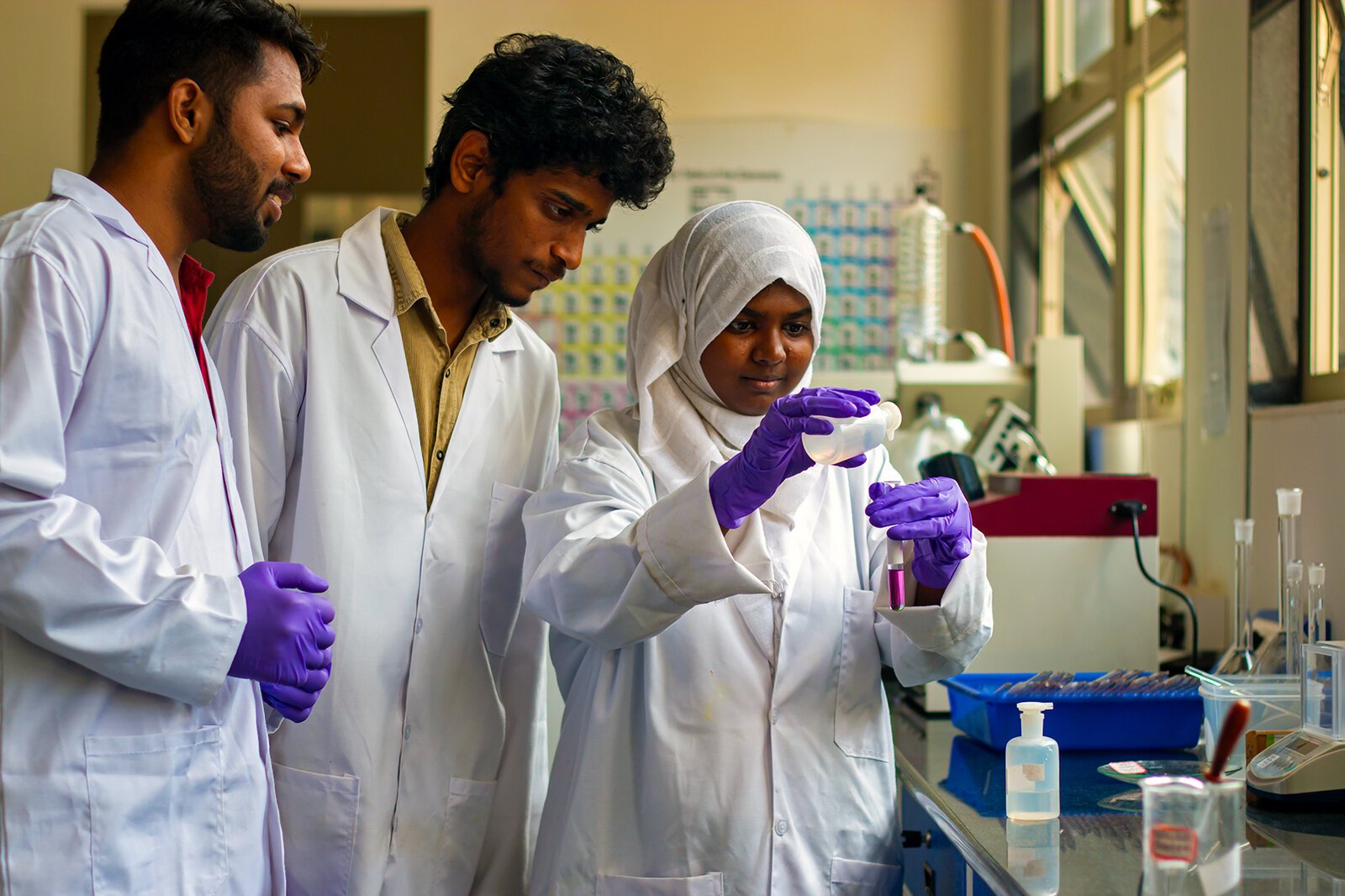 3 students in chemistry lab