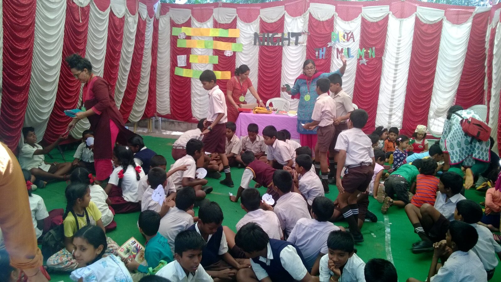 Students and teacher in a tent