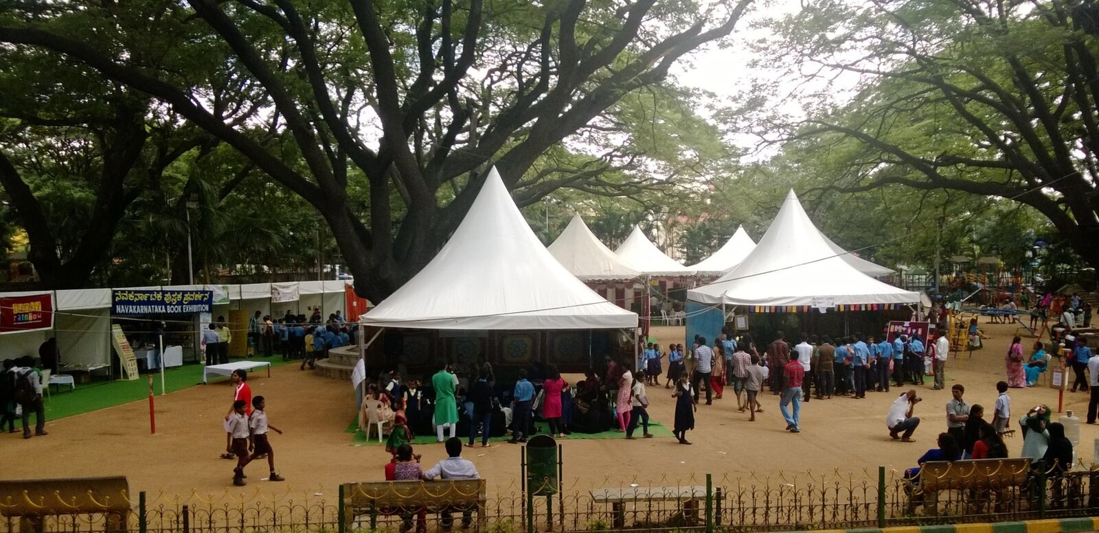 Market with tent and students