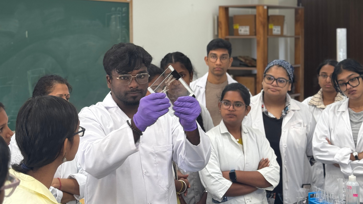 Academic associate Janaki Raman demonstrates the SDS-PAGE set-up to students.
