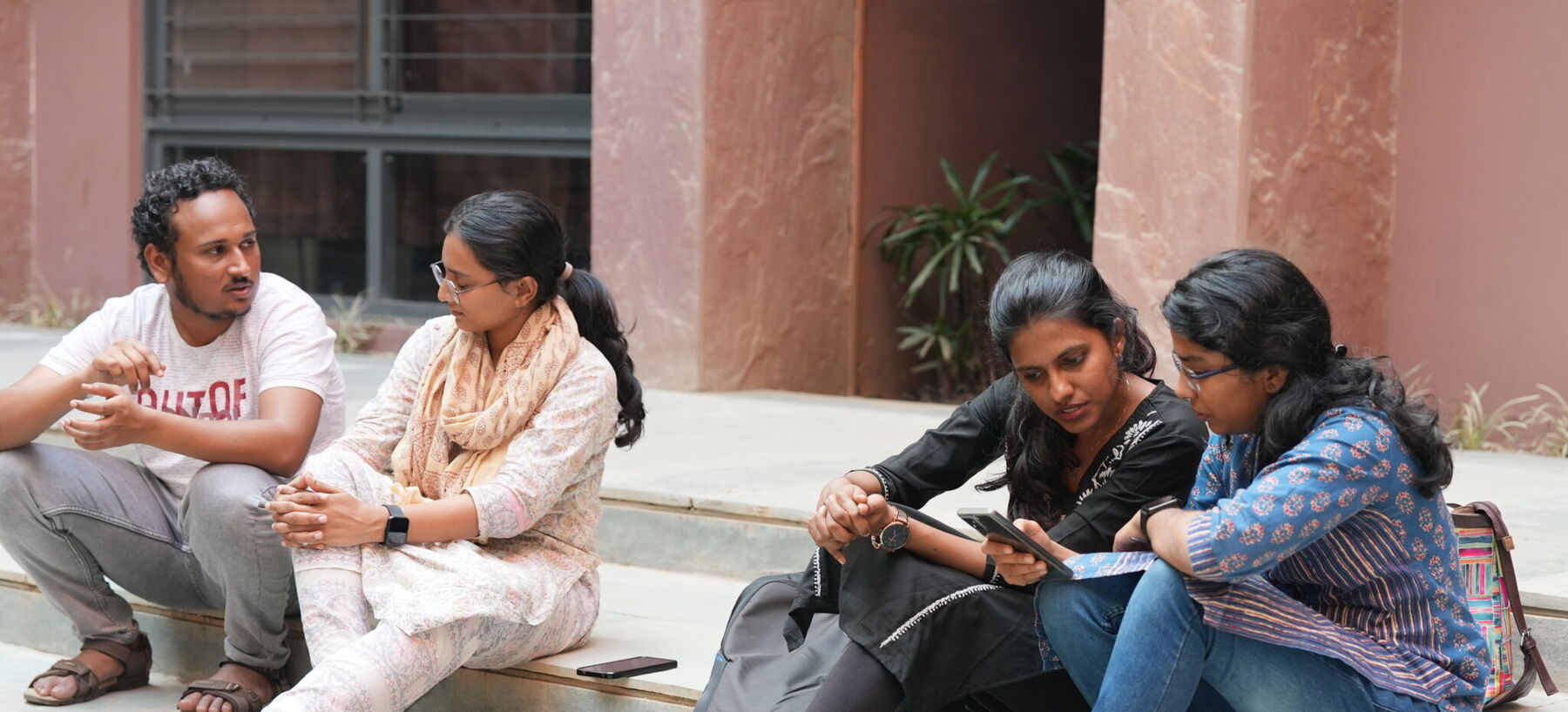 4 students on stair of APU Bhopal
