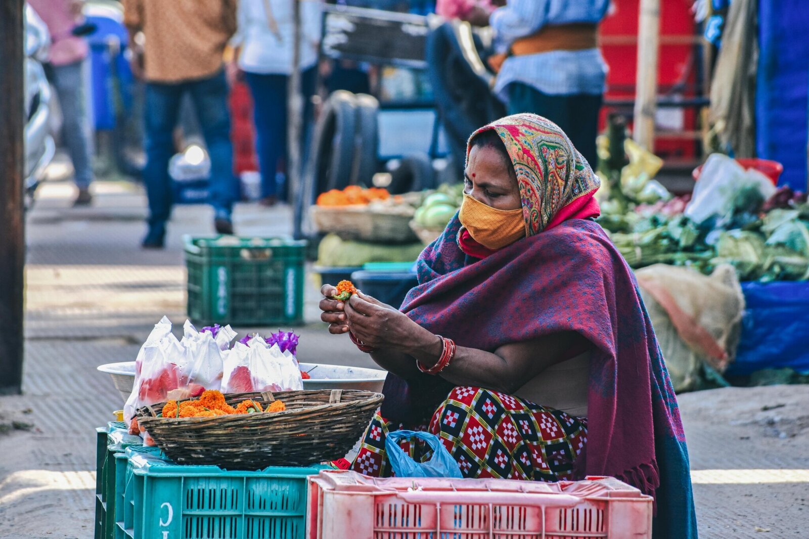 A woman vendor selling flowers in Bhubaneswar